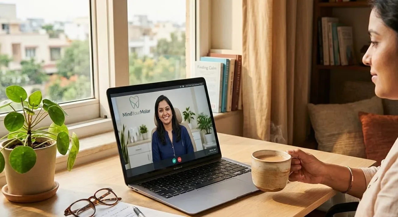 A woman at her desk at home on a video call with a dentist